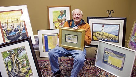 “Have Brush, Will Travel” is an apt name for the James Wegner exhibit at the Albert Lea Art Center from April 14 to May 16. While surrounded by all watercolors in the photo, his exhibit pieces also include pastels, colored inks, prints, collages and acrylics. He is holding “Yangze Fishing Boat,” a scene from China. In the lower left is “Ancient Tree” inspired by a trek to an Aztec ruin in Mexico. In the upper left is “Venice.” Behind him on the floor to the left is “Quarry Spring” and above it “Caribbean Drummer.” In the lower right is “Quarry No. 6” and above right is “Peggy’s Cove," inspired by a scene from Canada. Cathy Hay/Albert Lea Tribune