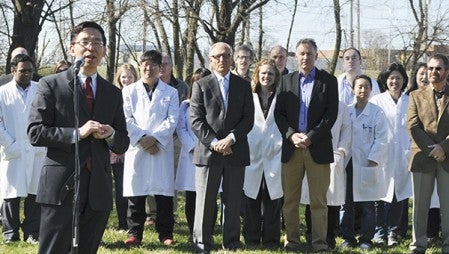 Dr. Zigang Dong, executive director of the Hormel Institute, discusses a new apartment complex for Institute researchers Monday during a groundbreaking ceremony. Hormel Foundation and Institute officials announced the 42-unit Science Park Housing complex will begin construction in May and be ready for occupancy at the beginning of 2016. Trey Mewes/trey.mewes@austindailyherald.com