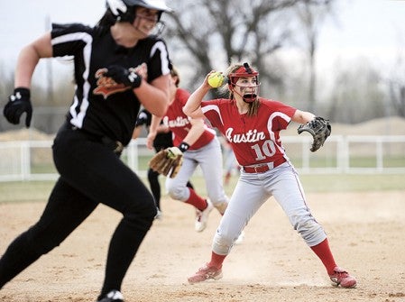 Austin's Brooke Pazurek looks home with the throw against Winona Thursday afternoon at Todd Park. Eric Johnson/photodesk@austindailyherald.com