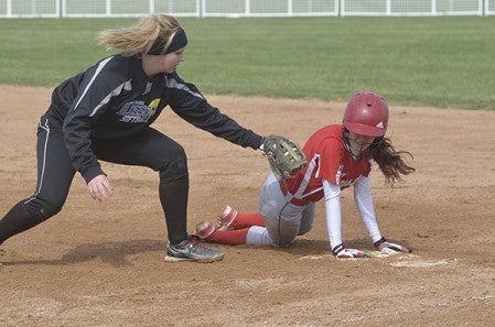 Austin's Bailee Brooks avoids a tag from Blooming Prairie's Kalyn Naatz in Todd Park Saturday. Rocky Hulne/sports@austindailyherald.com