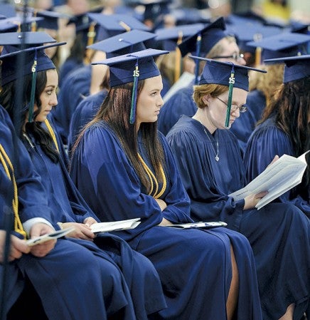 Riverland Students wait for the start of commencement Friday afternoon at Riverland Community College. Eric Johnson/photodesk@austindailyherald.com