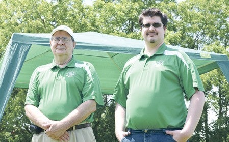 Norm Blaser stands with his son John Blaser during the Pacelli Catholic Schools Hall of Fame Golf Day at Meadow Greens Golf Course Friday afternoon. Blaser is retiring after 44 years working at Pacelli Catholic Schools Advancement Office and John is taking over his position. Jenae Hackensmith/jenae.hackensmith@austindailyherald.com