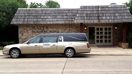 Mayer Funeral Home celebrated its 100th anniversary Wednesday with an open house and ribbon cutting with the Austin Area Chamber of Commerce.