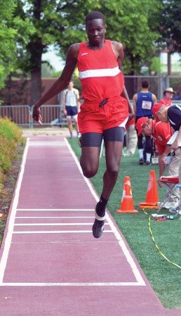 Austin's Jany Gash competes in the triple jump at the Minnesota Class AA state boys track and field meet in Hamline University in St. Paul Friday. Rocky Hulne/sports@austindailyherald.com