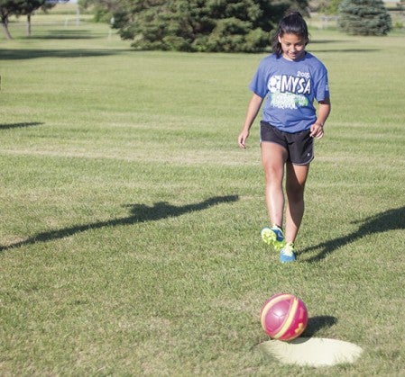 J.C. Rosas plays foot golf July 23 at Clarks Grove Golf Course. 