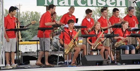 Brad Mariska directs the Austin High School Jazz Band during its brief set before weather canceled the Dick Schindler Memorial Concert Saturday. 