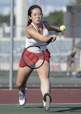 Valentina Truong-Ferreira reaches for the ball in her No. 2 singles match against Northfield at Paulson Courts Tuesday afternoon. Eric Johnson/photodesk@austindailyherald.com