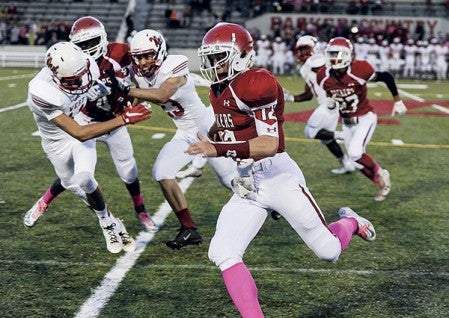 Austin quarterback Jakob Crouch clicks off a big run in the second quarter against Mankato West Friday night at Art Hass Stadium. Eric Johnson/photodesk@austindailyherald.com