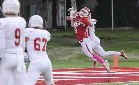 Zach Coffey steps in front of Mankato West’s Brock Annexstad and nearly picks off a pass in the endzone during the first quarter Friday night at Art Hass Stadium. Eric Johnson/photodesk@austindailyherald.com