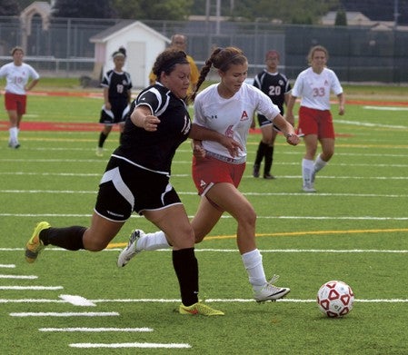 Austin's Christina Hernandez controls the ball against Worthington's Melanie Velasco in Art Hass Stadium Saturday. Rocky Hulne/sports@austindailyherald.com