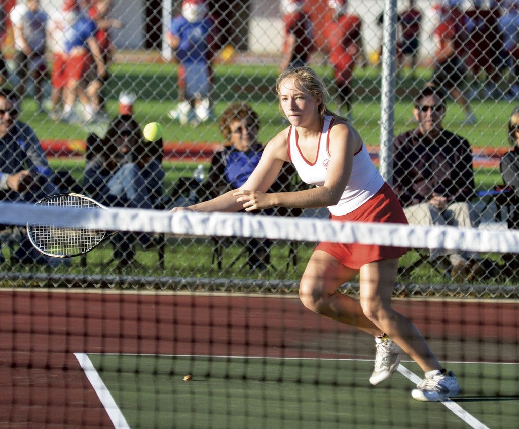Austin's Betsy Ettinger pursues the ball against Owatonna in Paulson tennis courts Tuesday. Rocky Hulne/sports@austindailyherald.com