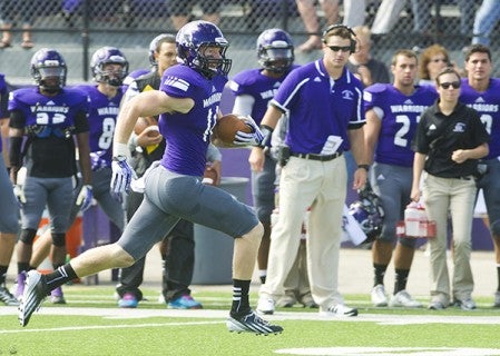 Winona State's Alan May (14) runs up the sideline on a punt return during a NSIC game against Minnesota State, Moorhead on Saturday, Sept. 21, 2013, in Winona. Herald File Photo