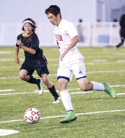 Austin’s Tucker Nelson moves the ball against Mankato East in the first half Thursday night at Art Hass Stadium. Eric Johnson/photodesk@austindailyherald.com