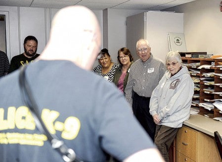 Members of the Austin Police Department’s citizen’s academy watch K-9 Sonic work in the basement of the Law Enforcement Center Tuesday night.  Eric Johnson/photodesk@austindailyherald.com