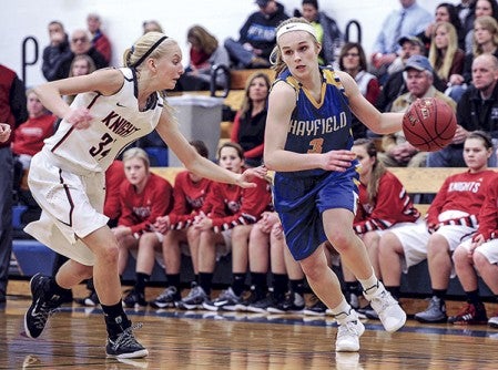 Hayfield’s Olivia Matti drives against Kenyon-Wanamingo’s Tess Hokanson during the first half Tuesday night in Hayfield. Eric Johnson/photodesk@austindailyheald.com