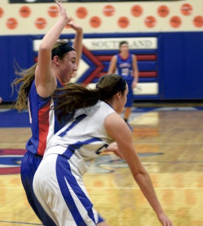 Southland's Kelsie Lamp plays defense on Winona Cotter's Gabby Bowlin in Adams Monday. Rocky Hulne/sports@austindailyherald.com