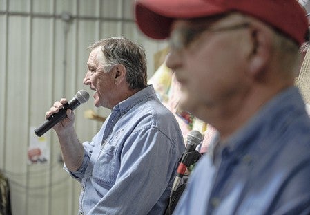 Auctioneer Mick Brooks calls the first item up for bid during the Lyle Area Cancer Auction Friday night in Lyle. Eric Johhnson/photodesk@austindailyherald.com