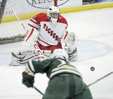 Austin goalie Noah Bawek looks in a shot during the first period Thursday night against Rochester Mayo. Eric Johnson/photodesk@austindailyherald.com