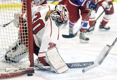 Mara Overby makes a save at the net for the Austin girls hockey team in Riverside Arena Monday. Rocky Hulne/sports@austindailyherald.com