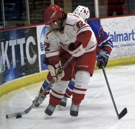 Myia Hoium controls the puck for the Packers in Riverside Arena Monday. Rocky Hulne/sports@austindailyherald.com