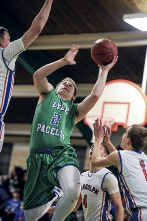 Lyle-Pacelli’s Braden Kocer goes up for an early first-half shot against Randolph in a Section 1A West Tournament matchup Thursday night in Pacelli. Eric Johnson/photodesk@austindailyherald.com