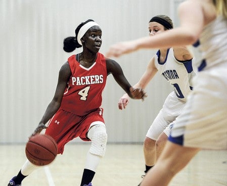 Austin’s Rebecca Younis cuts against the Owatonna defense during the first half Friday night in Ove Berven Gym. Eric Johnson/photodesk@austindailyherald.com