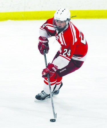 Austin’s Madison Overby handles the puck in Faribault Wednesday. Adam Holt/Faribault Daily News