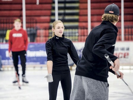 Amy Stoulil works with brother Jason Stoulil during practice Thursday for the Riverside Figure Skating Club’s annual show this weekend at Riverside Arena. 