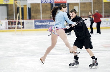 Senior Olivia Leuer rehearses with partner Brendan Dunlap for the Riverside Figure Skating Club-Austin boys hockey joint routine Thursday which will be part of the club’s upcoming show this weekend at Riverside Arena. 