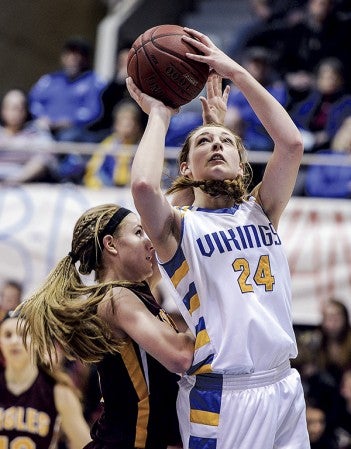 Hayfield’s Savanna Cordle shoots over Dover-Eyota’s Ashlee Olson during their Section 1AA semifinal game Saturday night in Mayo Civic Center. Eric Johnson/photodesk@austindailyherald.com