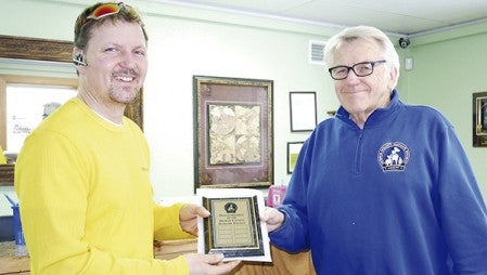 Mower County Humane Society President Barry Rush presented an award to David Yerhart, owner of Y Waste Removal. -- Photo provided