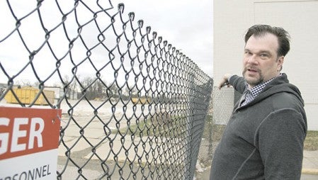 Younkers manager Randy Forster points to where the Oak Park Mall used to be. Younkers now stands alone after work to demolish the mall, and the clothing department store is coming off a remodel. 