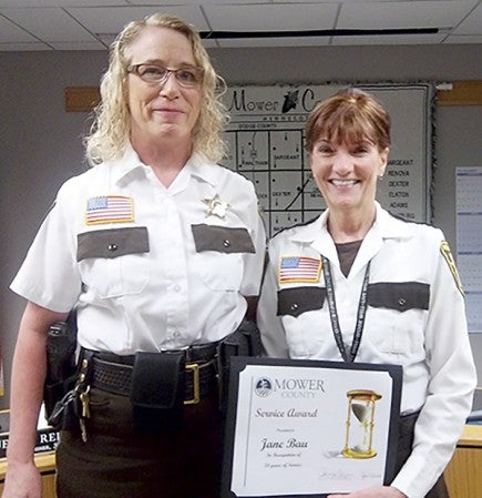 The  Mower County Board of Commissioners recognized Jane Bau last Tuesday. She retired April 29 after more than 24 years as the administrative assistant to the sheriff in the Mower County Law Enforcement Center. She worked with three sheriffs. “We’ll miss her. I’ll miss her, I know that for certain,” Sheriff Terese Amazi said.  Photo provided