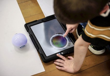 Chaz Bonorden uses a simple program to tell Sphero what to do during a meeting of the Woodson Coding Club Tuesday at Woodson Kindergarten Center. Eric Johnson/photodesk@austindailyherald.com