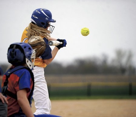 Hayfield’s Alexis Dudycha takes a swing at a pitch against Randolph in Hayfield Tuesday. Rocky Hulne/sports@austindailyherald.com