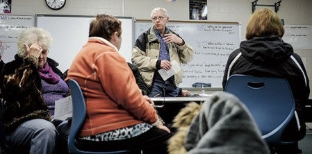 Gary Gonnerman of Lyle speaks during the GOP caucus in March at Ellis Middle School. 