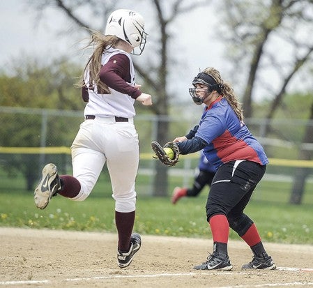 Southland’s Mikayla Emanuel hauls in the throw to get the out on Chatfield’s Kaylie Bernard Thursday in Rose Creek. Eric Johnson/photodesk@austindailyherald.com