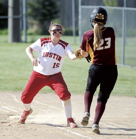 Austin’s Jordan Huntley tags Northfield’s Rachel Kelly Thursday at Todd Park. Eric johnson/photodesk@austindailyherald.com