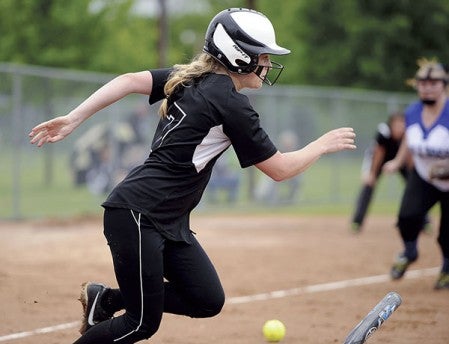 Blooming Prairie’s Linnea Sunde heads for first after dropping a bunt against Janesville-Waldorf-Pemberton in a Section 1A West elmination game Friday at Todd Park. Eric Johnson/photodesk@austindailyherald.com