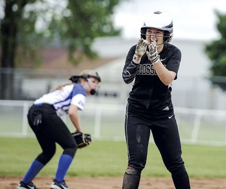 Blooming Prairie’s Bria Baldwin applauds to the Blossoms dugout after a stand-up triple against Janesville-Waldorf-Pemberton Friday in a Section 1A West elimination game at Todd Park. Eric Johnson/photodesk@austindailyherald.com