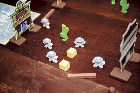 Game pieces are arrayed at the start of Michael Jordal’s recently purchased game, “Flick ‘Em Up.”