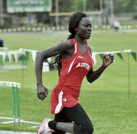 Austin’s Odongonga Oballa runs in the 200-meter dash preliminaries at the Big Nine track and field meet in Faribault Friday. File Photo