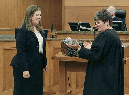 Christa Daily smiles as Judge Jodi Williamson talks about the gifts she’s receiving for her swearing in as the newest Third Judicial District judge on Friday in the Mower County Jail and Justice Center. Jason Schoonover/jason.schoonover@austindailyherald.com