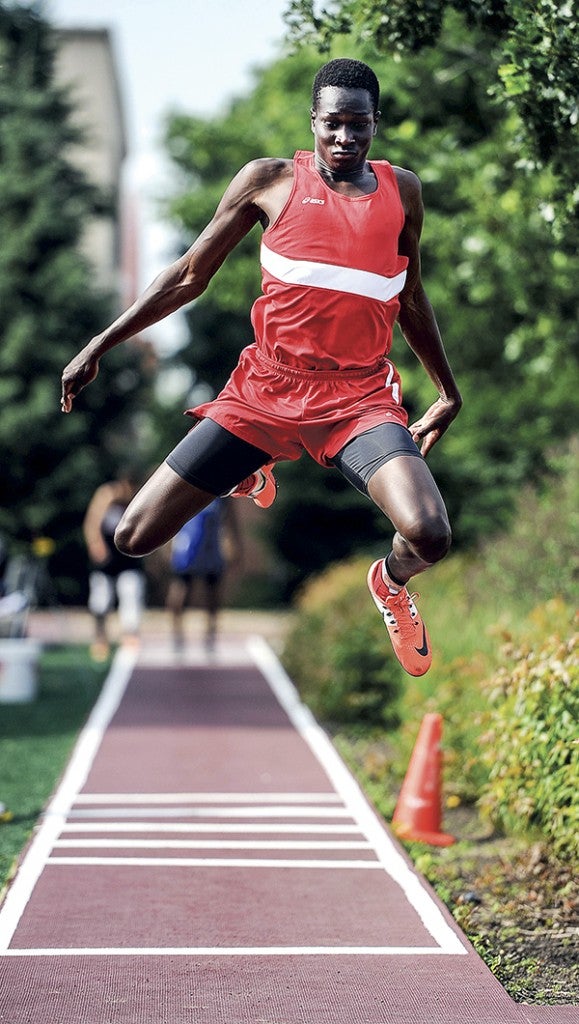 Austin’s Jany Gash makes one of his jumps in the preliminaries of the triple jump during the Minnesota Class AA State Track and Field Meet at Hamline University. Eric Johnson/photodesk@austindailyherald.com