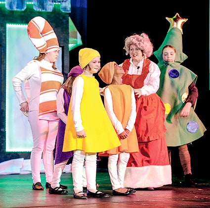 Mrs. Claus, played by Krista Johnson arranges her troupe for a dance number the Matchbox Children’s Theatre presentation of “Just in the Nick of Time Thursday afternoon. 