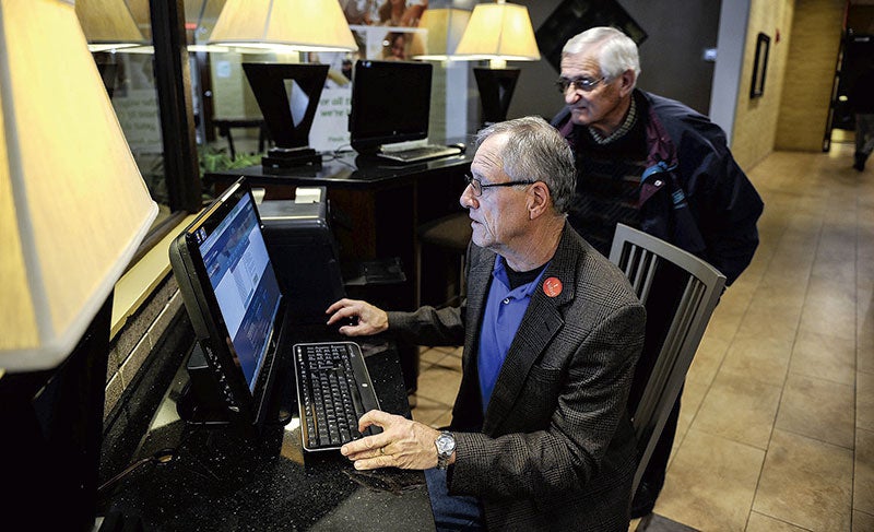 Challenger for 27B Dennis Schminke looks over early results.Eric Johnson/photodesk@austindailyherald.com