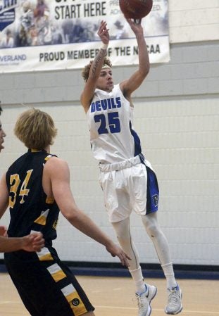 Riverland’s Jace Klinker pulls up for a jump shot against Gustavus JV in Riverland Gym Saturday. Rocky Hulne/sports@austindailyherald.com