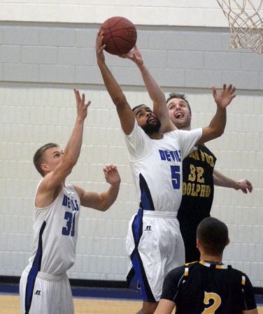 Riverland’s Abdibari Abdikadir fights for a rebound against Gustavus JV in Riverland Gym Saturday. Rocky Hulne/sports@austindailyherald.com