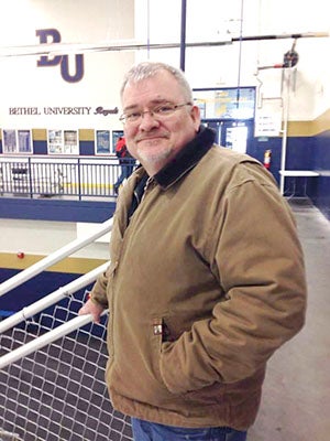 Jim Bennett at one of his favorite places — a hockey arena. Photo provided.