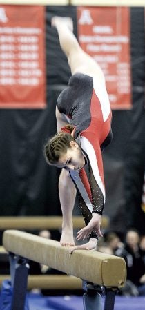 Austin’s Samantha Sheldon performs on the beam during a dual against Faribault Friday night at the YMCA. Eric Johnson/photodesk@austindailyherald.com